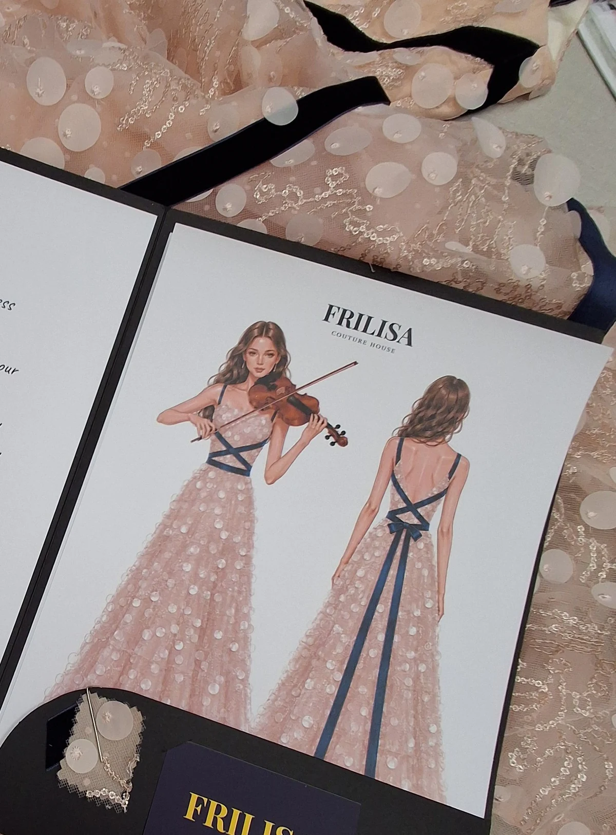Shira Fuchs’s Couture-Pass with a design illustration and fabric sample, resting on her FRILISA concert gown